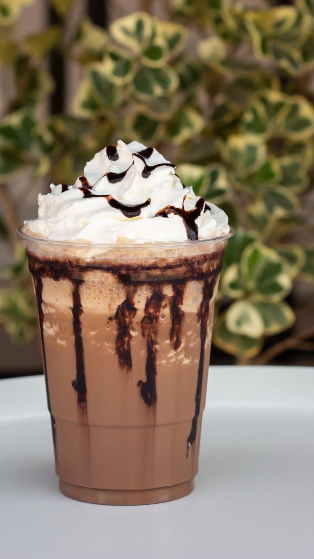  One sip of this Chocolate Mocha Frappe and you'll feel like you're on a tropical island sipping on a coffee cocktail.