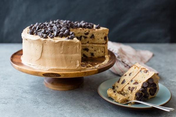  Rich chocolate chips are scattered throughout the cake, adding texture and flavor to each bite.