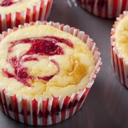  Warm, freshly baked raspberry muffins straight out of the oven.
